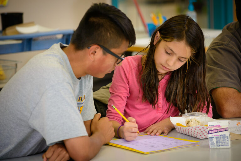 Student teacher with young student